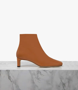 Designed to elevate the everyday, our Parade boot is crafted to a sleek, sculptural silhouette. Choose from a 50mm sculpted or block heel for the perfect amount of lift with ample arch support. Our perfectly placed zip runs all the way down to the arch for easy slip-on, regardless of foot type, while the superior leather options mould to your foot for the perfect fit. Let the modern square toe ground all your daytime looks.