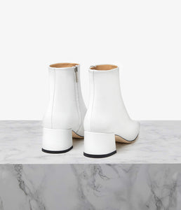 Designed to elevate the everyday, our Parade boot is crafted to a sleek, sculptural silhouette. Choose from a 50mm sculpted or block heel for the perfect amount of lift with ample arch support. Our perfectly placed zip runs all the way down to the arch for easy slip-on, regardless of foot type, while the superior leather options mould to your foot for the perfect fit. Let the modern square toe ground all your daytime looks.