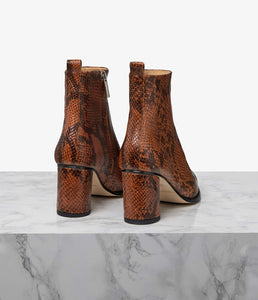 A modern take on Western-inspired ankle boots, Totem is designed to a striking, pointed-toe silhouette for a timeless, versatile feel. Crafted from a single piece of leather this seamless wonder is unmatched in both comfort and design. Finished with an asymmetrical cylinder heel, let the Totem adds a directional feel to both your on and off-duty wardrobe.